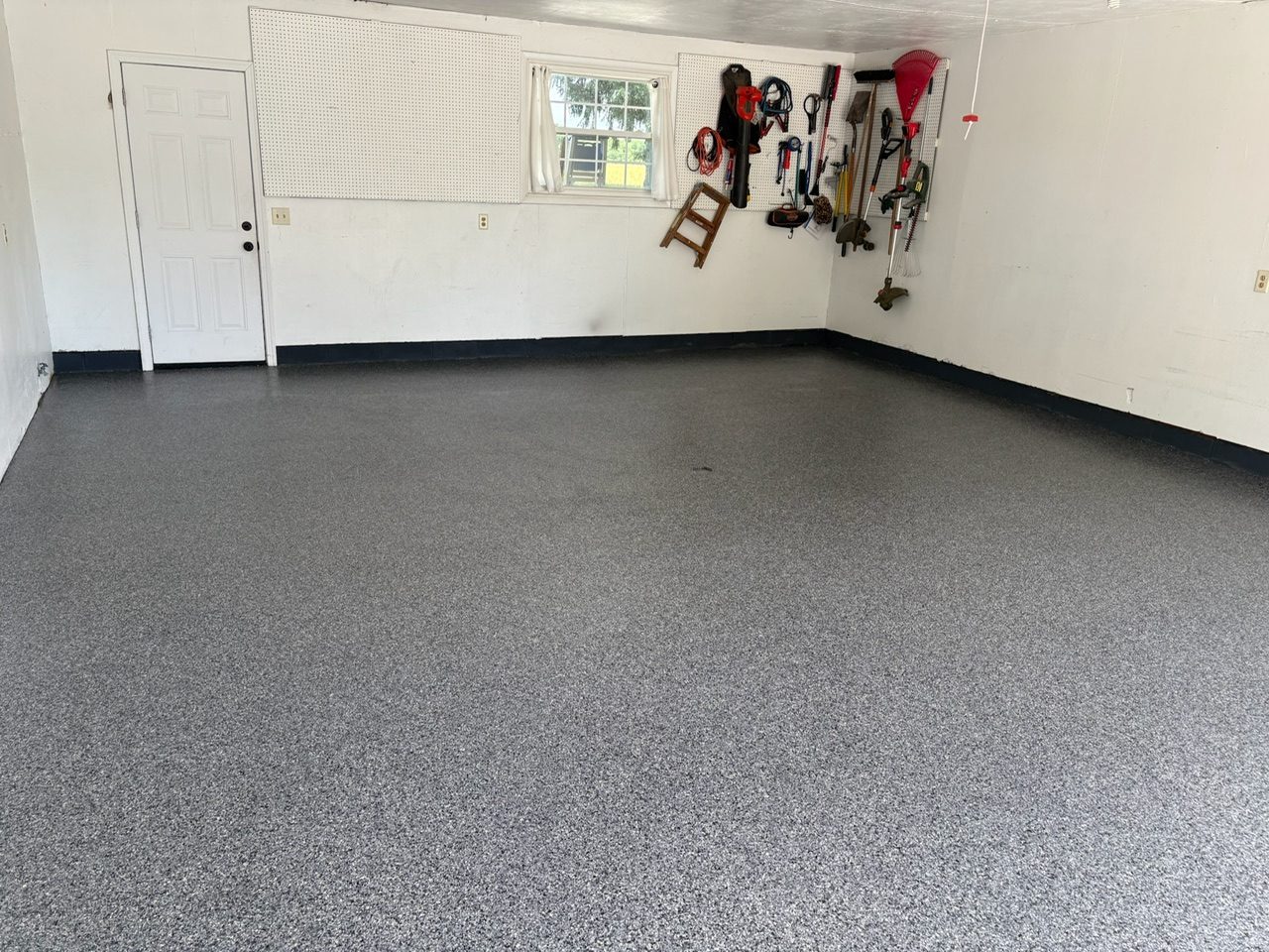 After — finished gray flake garage floor