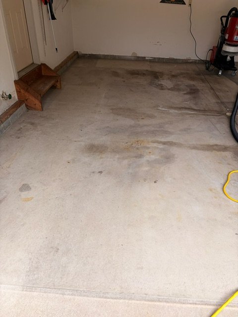 Before — stained garage concrete