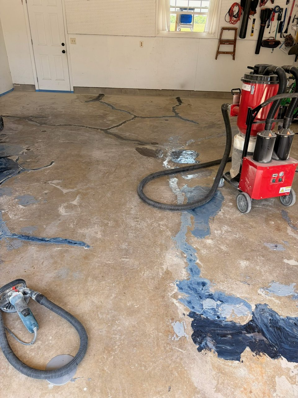 Before — cracked bare concrete during grinding