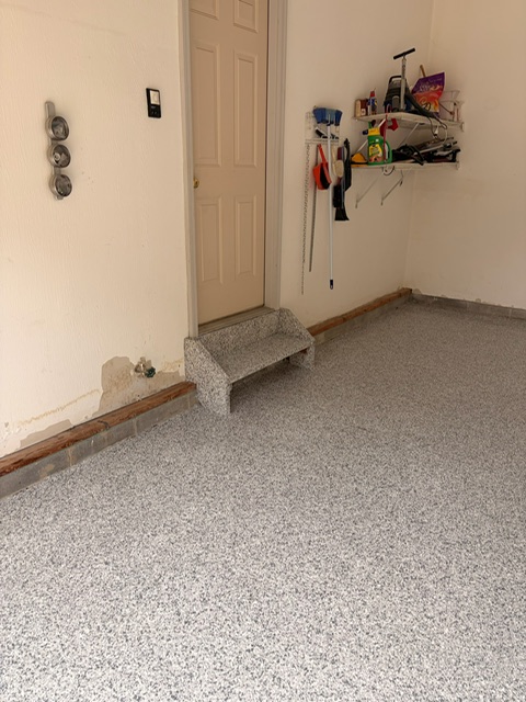 Finished garage floor with coated step